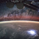 Illustration for article titled This Is Just Too Much: Lightning Illuminates the ISS With the Milky Way As a Backdrop